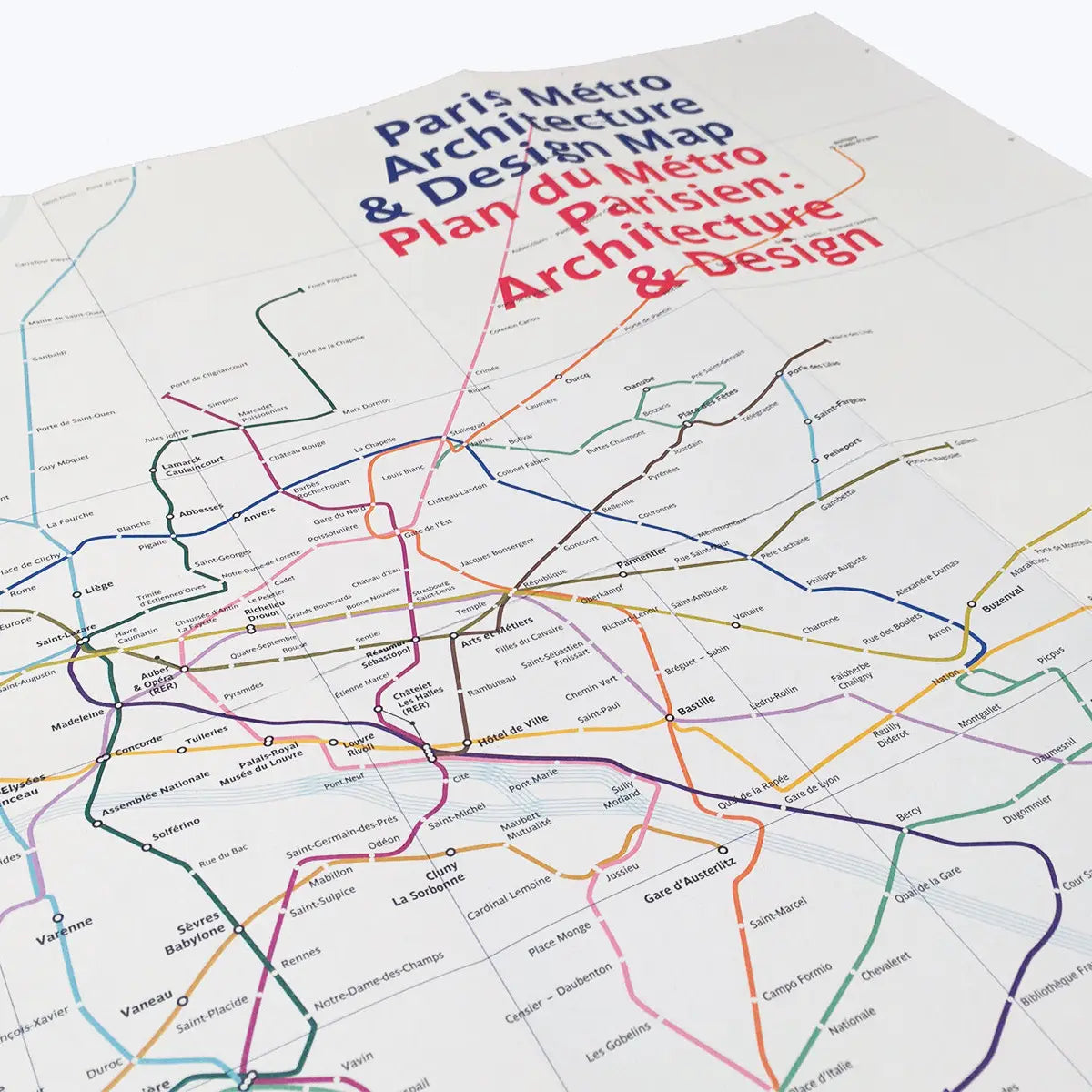 A sophisticated dark gray brochure titled "Blue Crow Media Paris Metro Architecture Map," featuring "plan du métro" in reverse at the bottom. This map is ideal for any design aficionado and offers a deep dive into the Art Nouveau entrances and beyond.