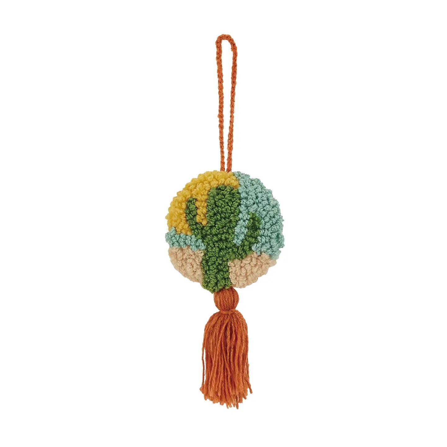 The Peking Handicraft Hanging Cactus Decoration is a circular keychain featuring a woven green cactus on a desert background. It comes with an orange loop and matching tassel, includes a poly hook for easy attachment, and has blown-in filled padding for added durability.