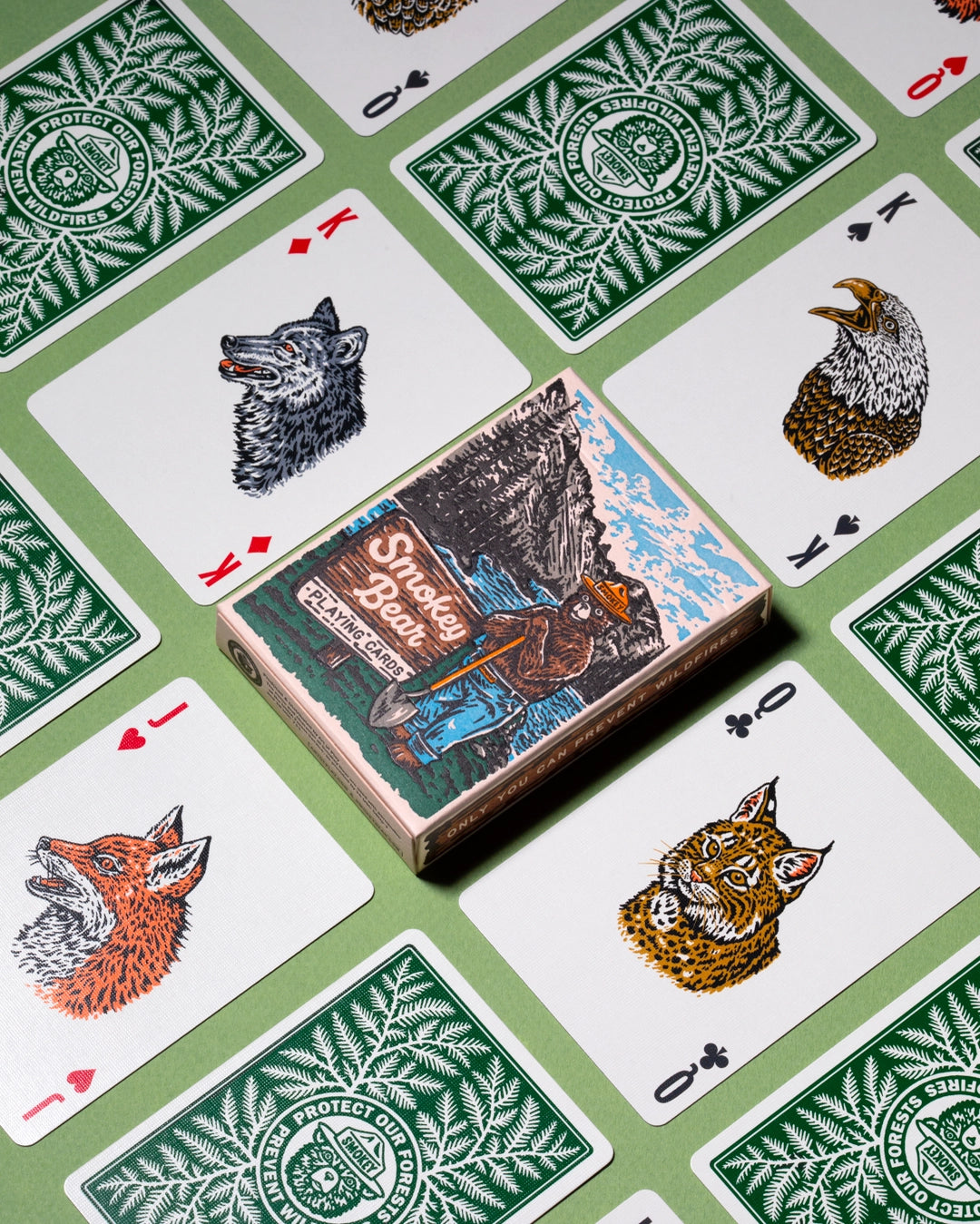 Smokey Bear Playing Cards by Art Of Play with wildlife artwork in eco-friendly box, perfect for collectors and nature lovers.