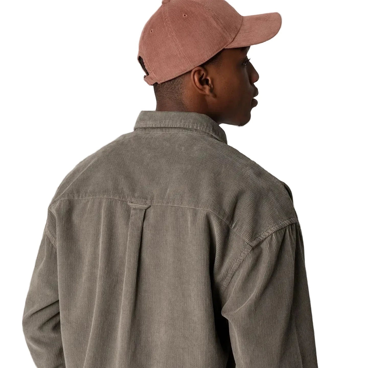 Man in taupe shirt models Forager Provisions Redwood Cord Baseball Cap with patch on white background; trendy hat fashion style.