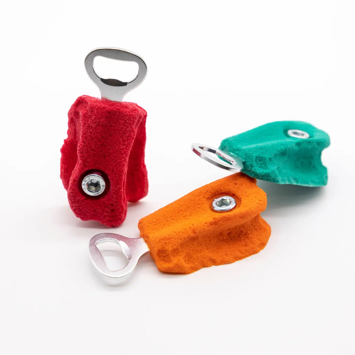 Forager Provisions LTD Seven Peaks climber-shaped bottle openers in red, orange, and green resin and metal