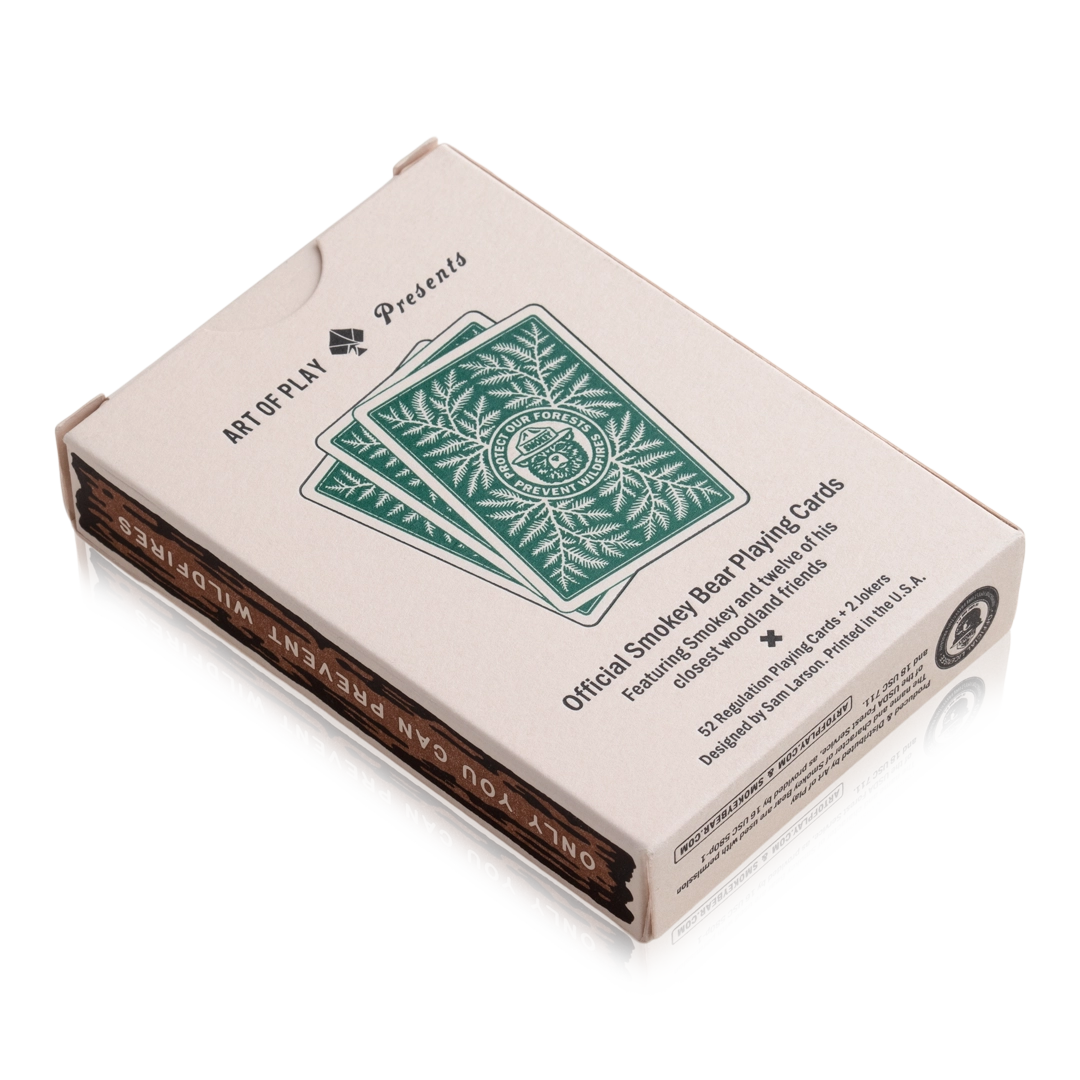 Art of Play Smokey Bear Playing Cards: beige box, conservation leaf design, unique collectible deck for card game lovers.