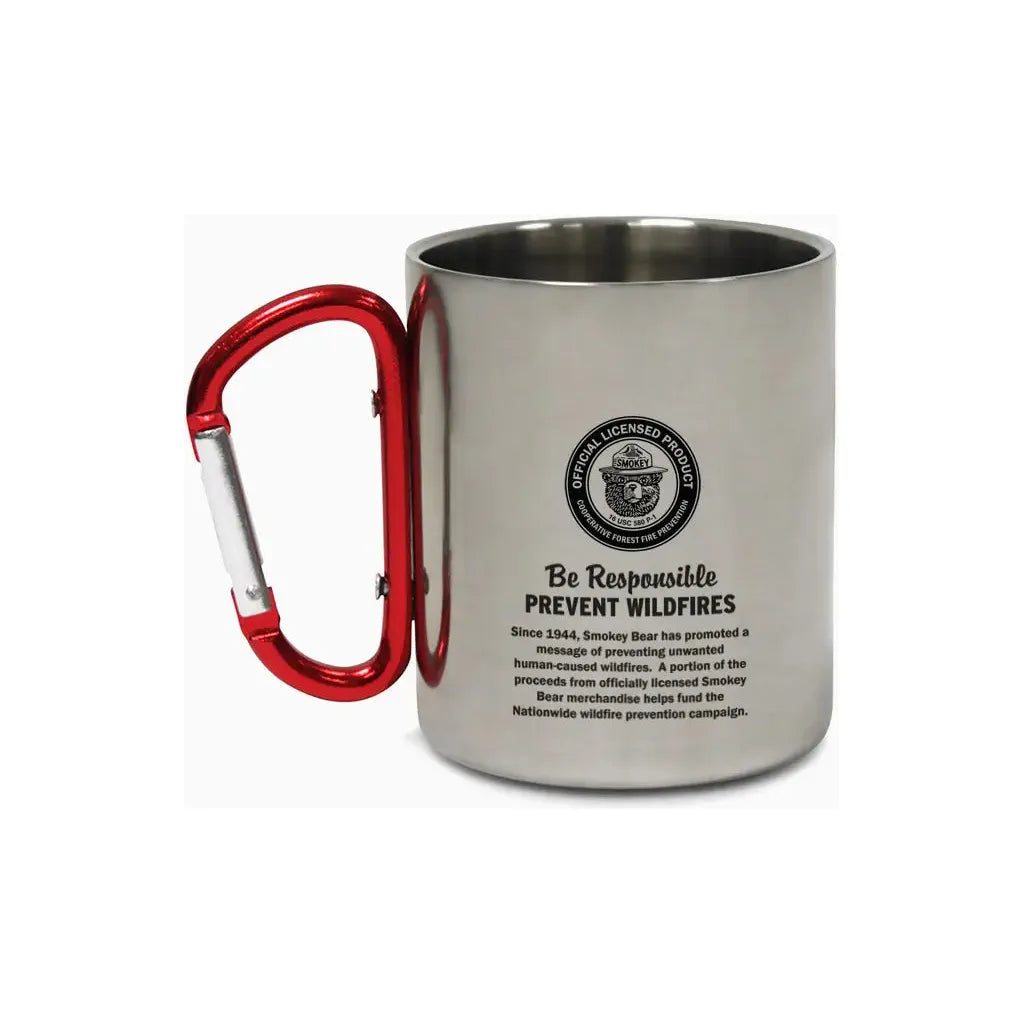 The Smokey Bear Carabiner Handle Mug - Prevent Wildfires features a stainless steel design with Smokey Bear’s face, "SMOKEY" on his hat, and the message "PREVENT WILDFIRES." Its handle is a sturdy red carabiner, ideal for outdoor enthusiasts dedicated to wildfire prevention.