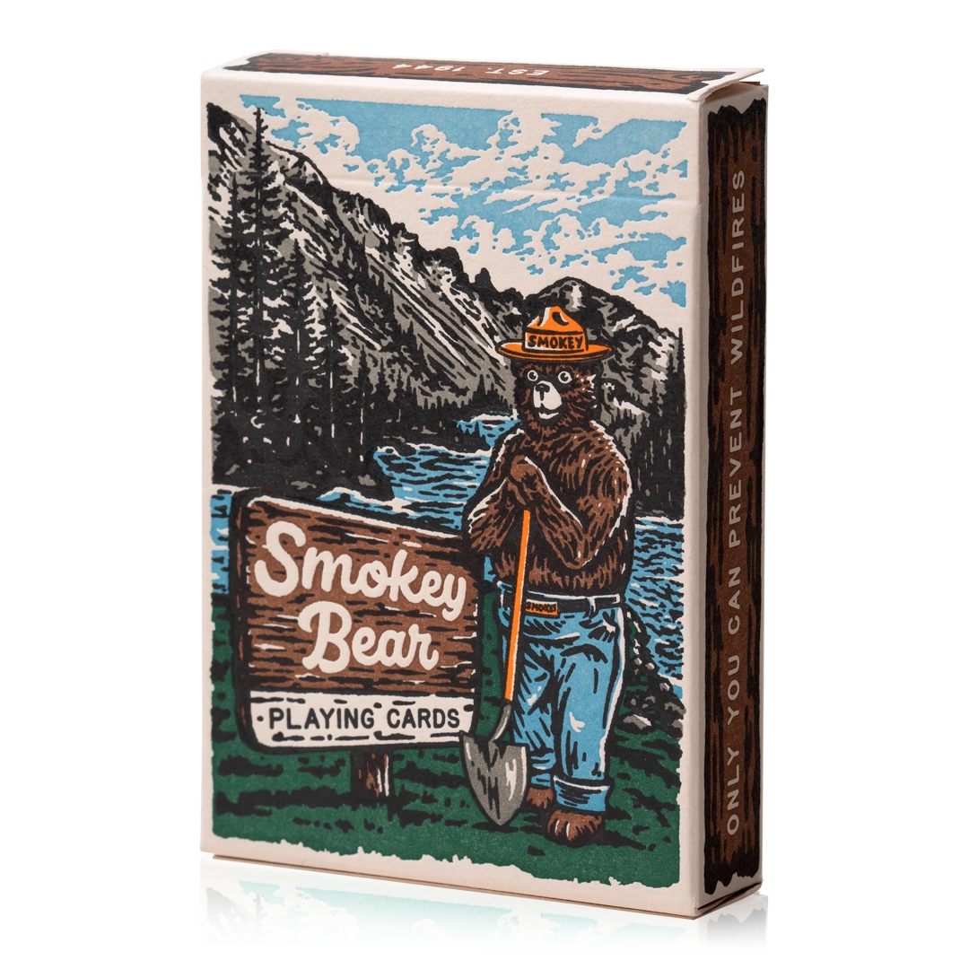 Smokey Bear Playing Cards by Art Of Play: Smokey near a lake, wildfire sign, eco-friendly deck, collectible cards.