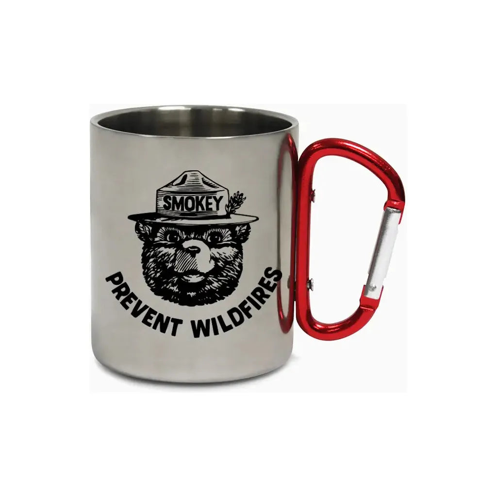 The Smokey Bear Carabiner Handle Mug - Prevent Wildfires features a stainless steel design with Smokey Bear’s face, "SMOKEY" on his hat, and the message "PREVENT WILDFIRES." Its handle is a sturdy red carabiner, ideal for outdoor enthusiasts dedicated to wildfire prevention.