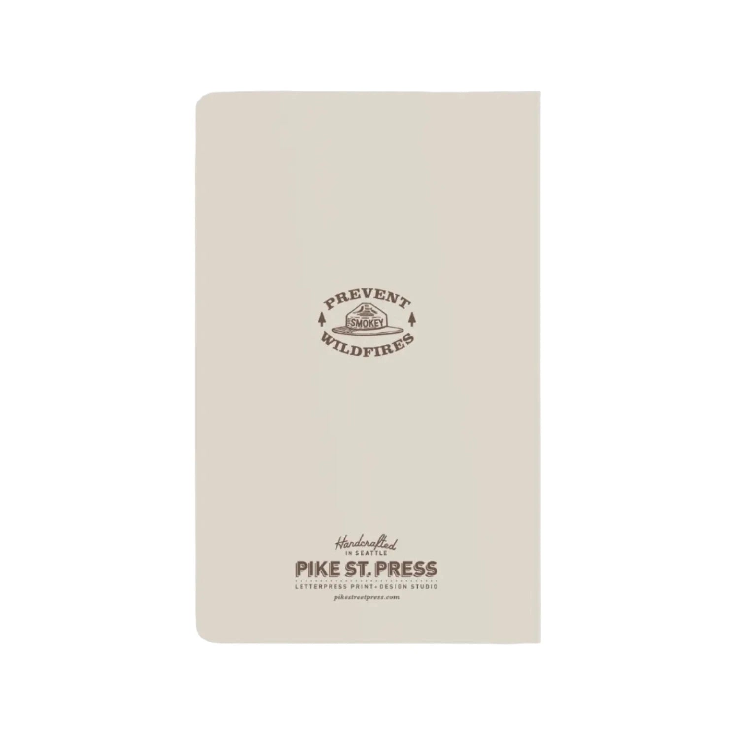 Back of a beige notepad with smokey bear hat motif in brown and prevent wildfires quote.