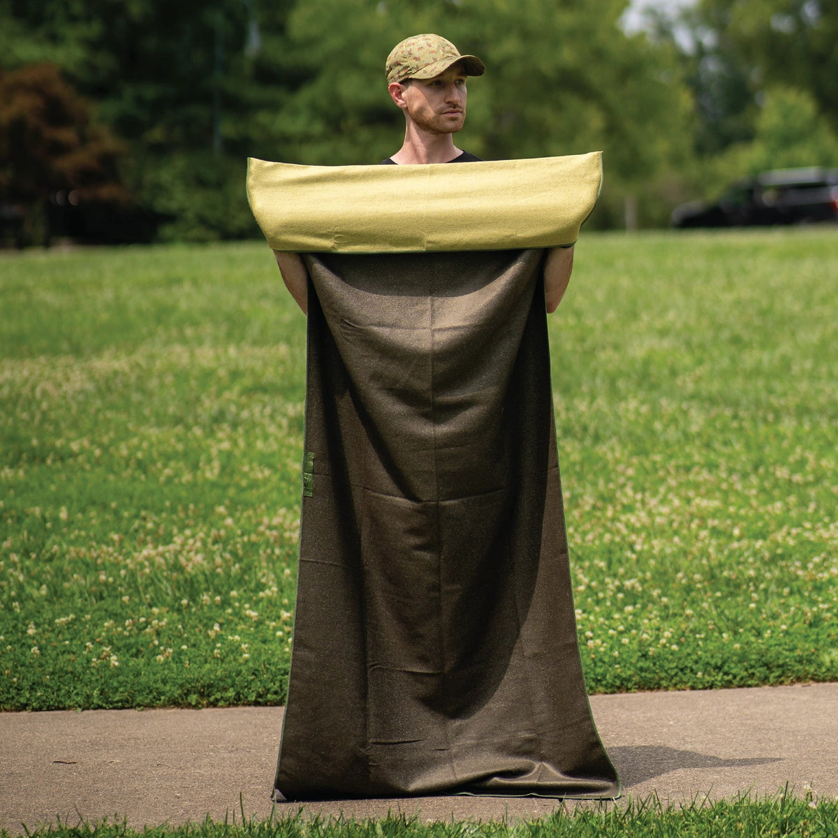 Forager Provisions LTD Sprints Grizzly Guide car seat cover towel in dark brown with a light green headrest section