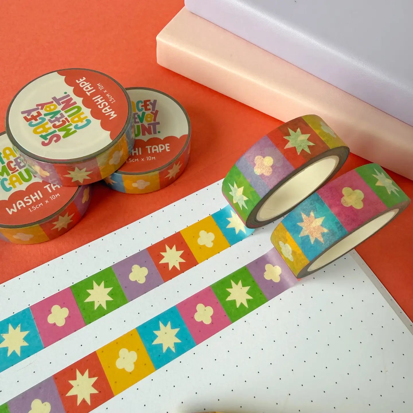 Stacey McEvoy Caunt Rainbow Medieval Grid washi tape rolls for journaling, displayed on dotted paper for craft inspiration.