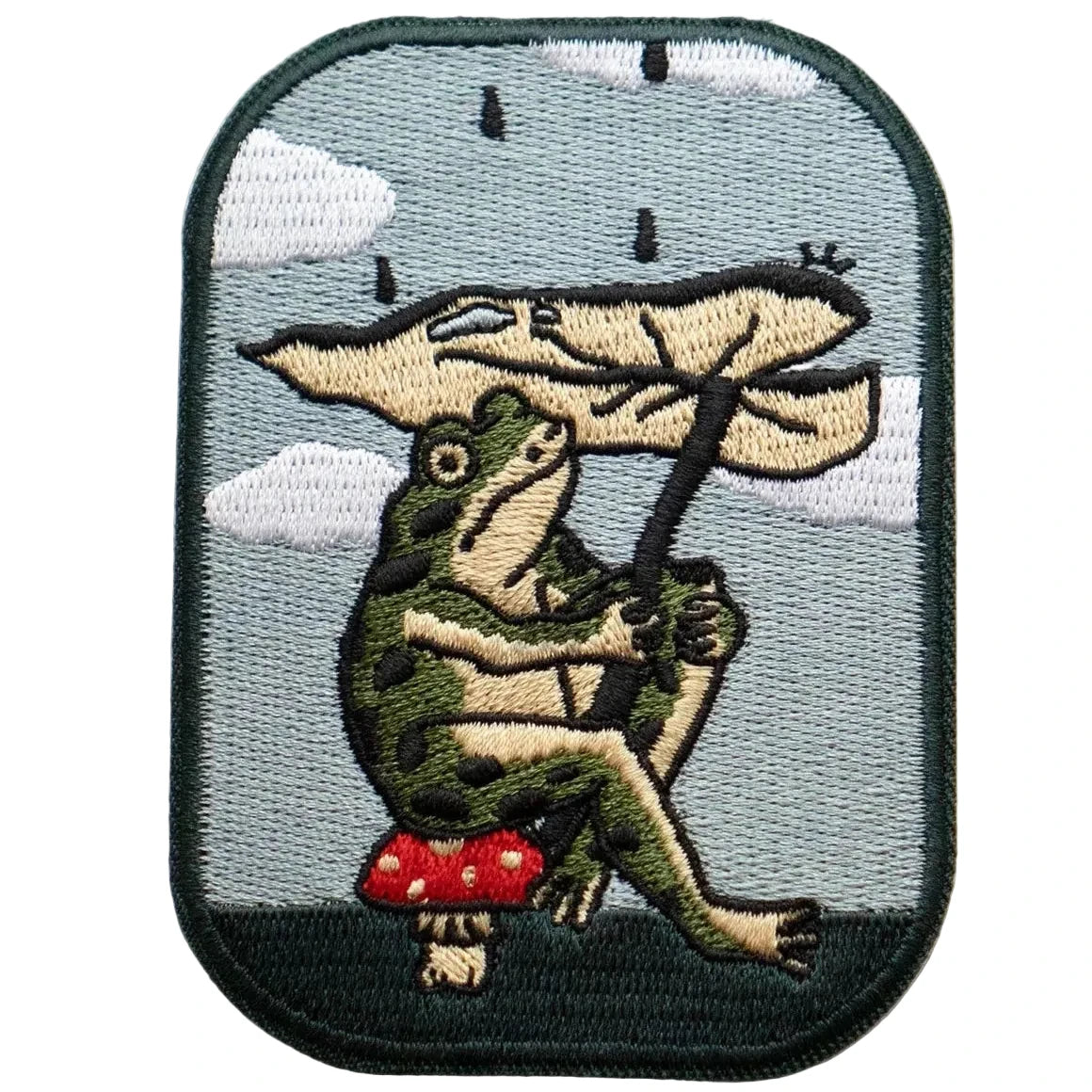 Stay Home Club patch shows a cute frog holding a leaf umbrella on a red mushroom, perfect for cozy rainy day fashion accessories.