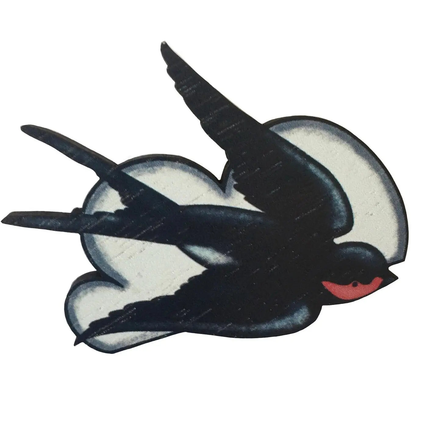 The Su Owen Swallows Brooch features a wooden pin in the shape of a flying swallow, with black and white wings and a red neck, crafted from sustainable walnut by Su Owen, set against a bright blue background.