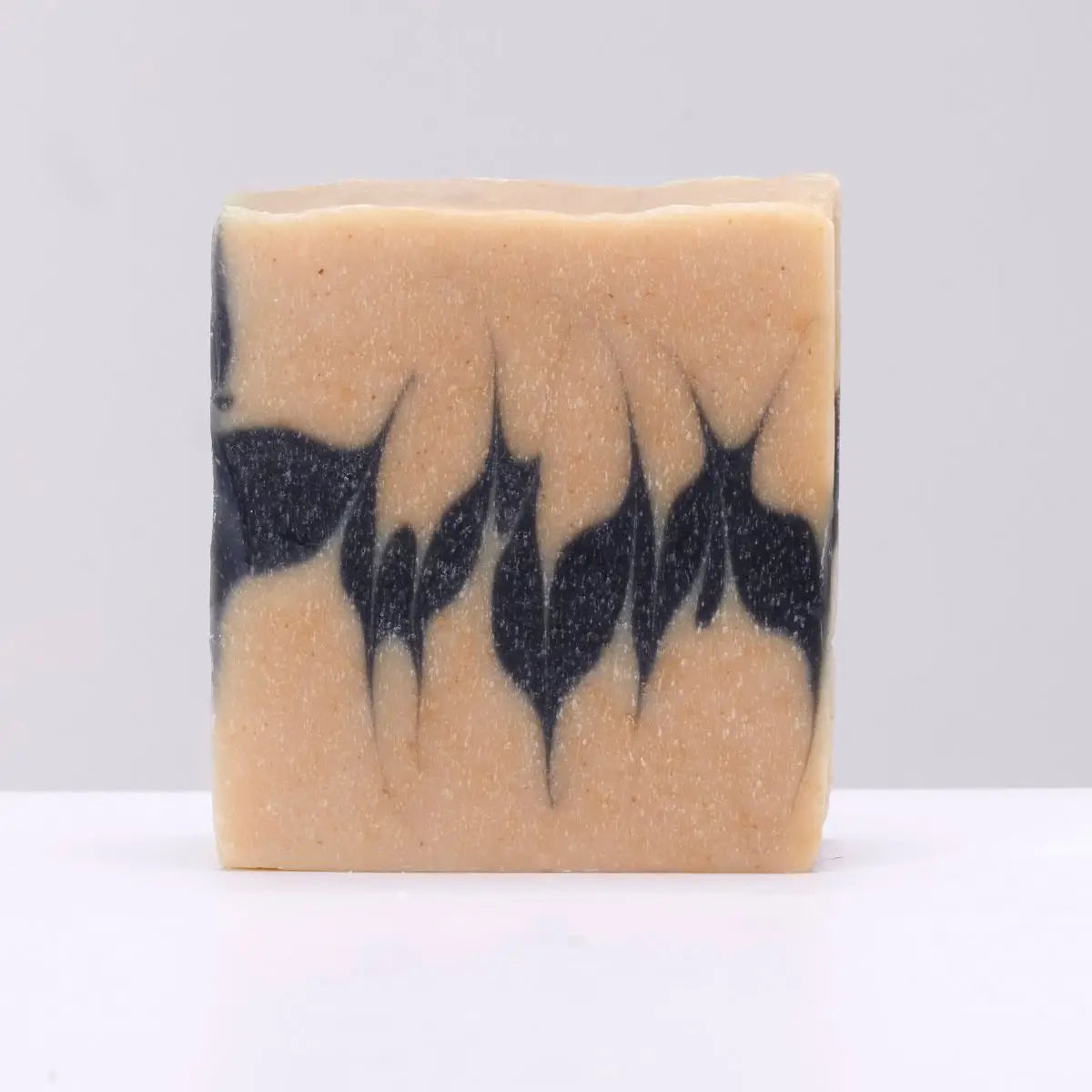 The Black Stuff Peppermint & Honey Irish Soap bar, rectangular with black swirls on beige, natural handmade skincare soap.