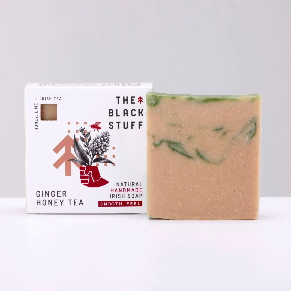 Ginger Honey Tea soap bar with green swirls by The Black Stuff, natural handmade soap beside branded eco-friendly box.