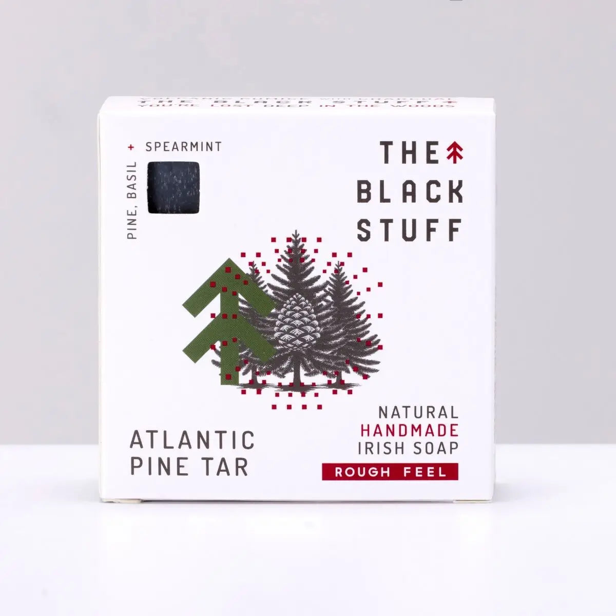 Box of The Black Stuff Pine Tar Soap, handcrafted, with pine tree and cone design on packaging—natural skincare bath bar.