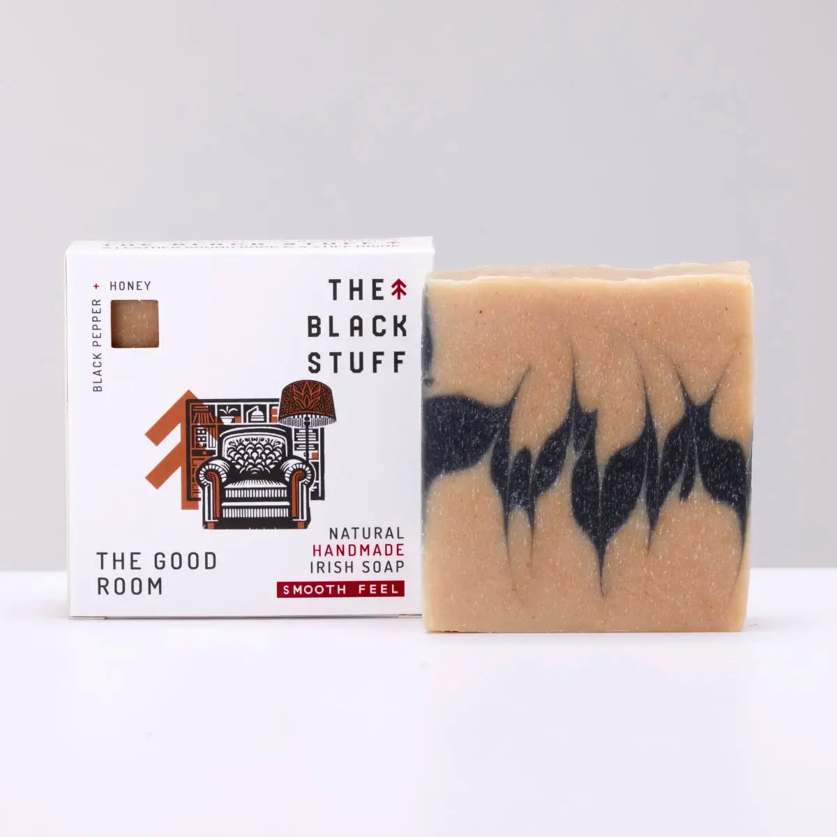The Black Stuff Soap Peppermint & Honey bar is displayed next to its branded box for The Good Room, natural skincare product.
