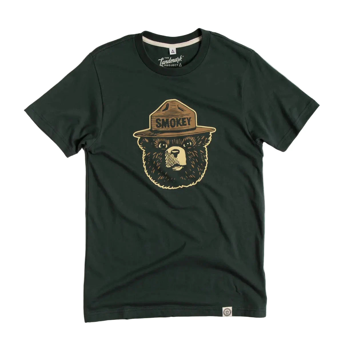 The Landmark Project Smokey Bear Logo Tee in pine green with iconic ranger hat graphic, ideal for wildfire prevention awareness.
