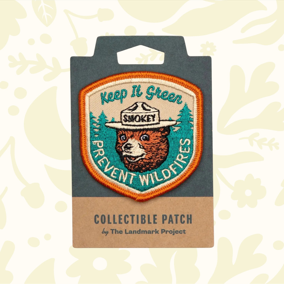 The Landmark Project Smokey Bear Patch - Keep It Green is a collectible patch featuring Smokey Bear in a hat, with the text "Keep It Green" and "Prevent Wildfires," endorsed by the USDA Forest Service for wildfire prevention.