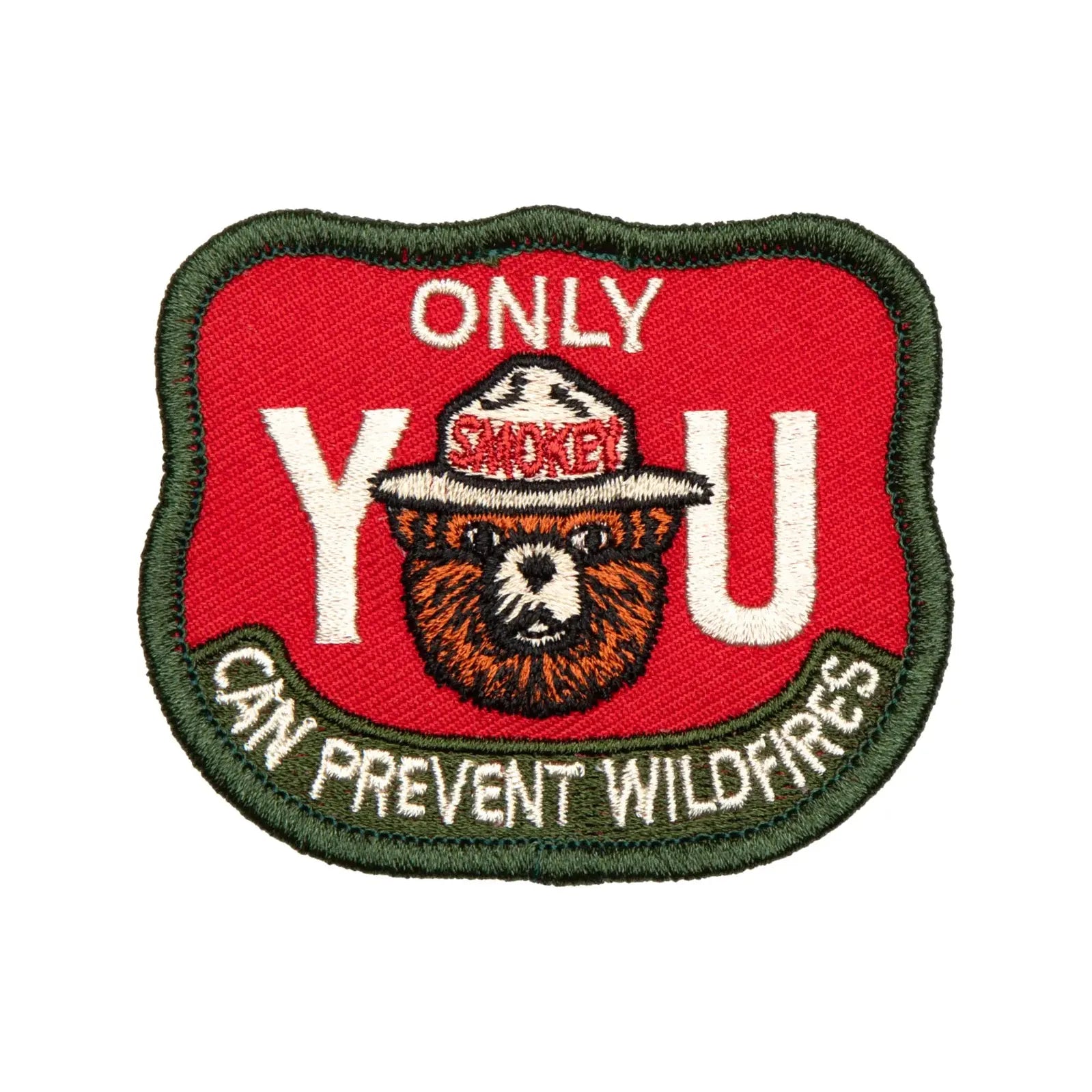 The Landmark Project Smokey Bear Patch - Only You Firewatch features a collectible design showcasing Smokey the Bear's face between large letters spelling "YOU" with the message "ONLY YOU CAN PREVENT WILDFIRES." This officially licensed product from the USDA Forest Service promotes wildfire prevention education.