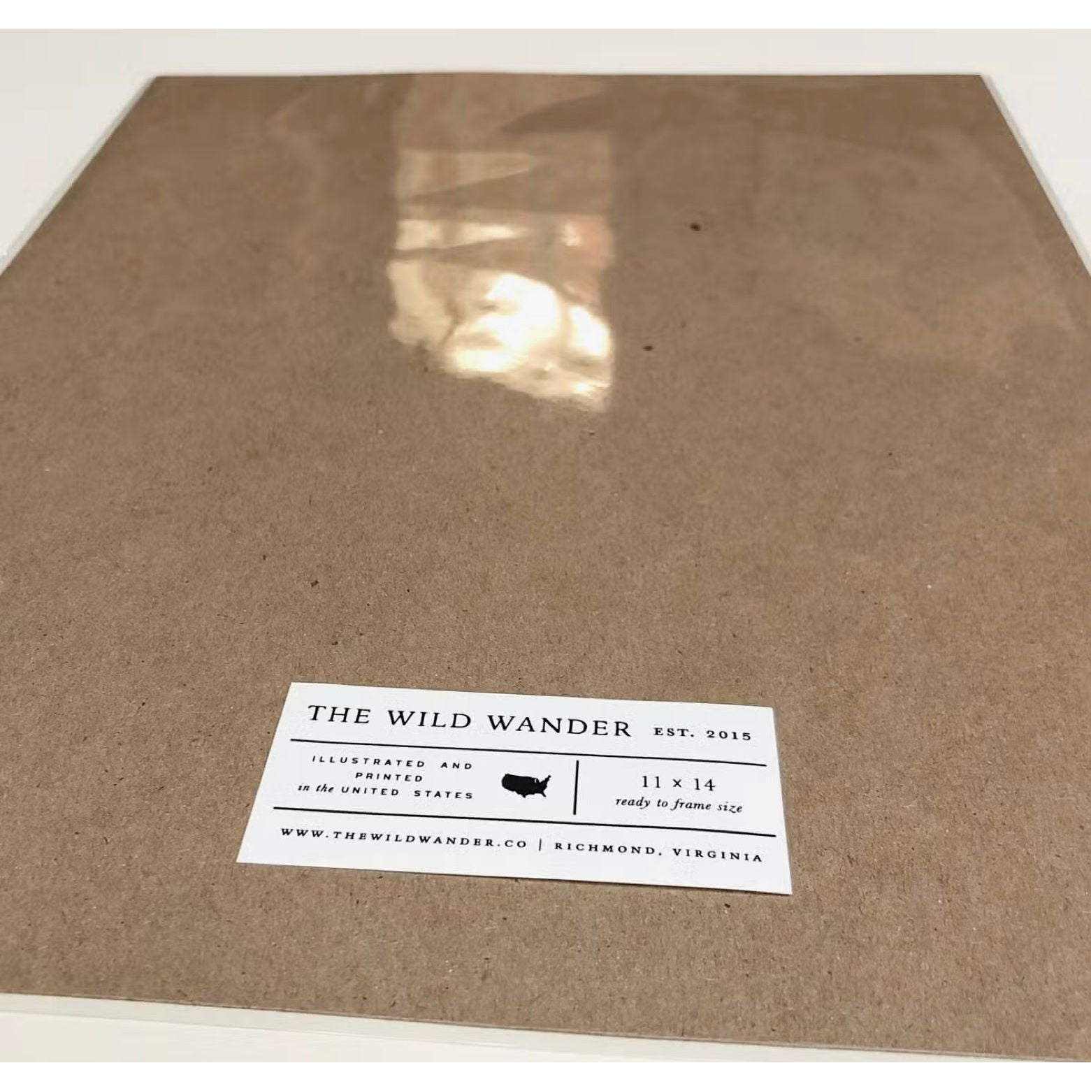 A flat, brown, framed illustration titled "The Wild Wander Oyster Shucking Field Guide Print (11x14)," with a tag reading "The Wild Wander, Est. 2015, Richmond, Virginia" at the bottom—perfect kitchen wall-art for oyster shuck enthusiasts or admirers of letterpress charts.