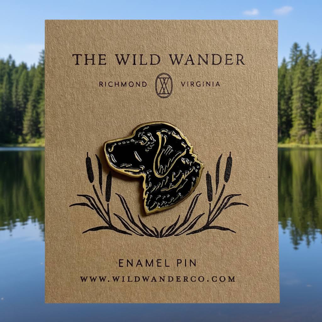 The Wild Wander Black Lab Enamel Pin in black and gold on brown card, unique dog pin by The Wild Wander, Richmond VA.
