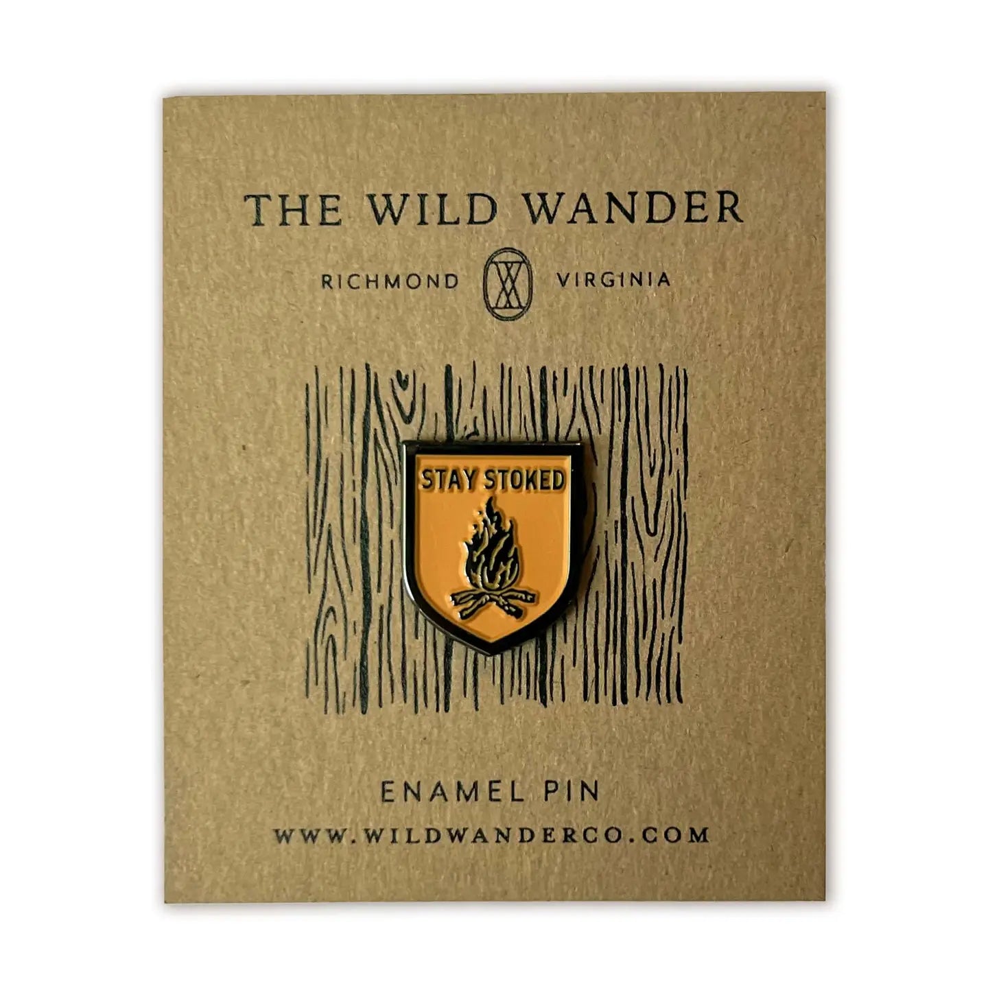 The Wild Wander Stay Stoked enamel pin features a bright yellow campfire, ideal outdoor gift for campers and adventure lovers.