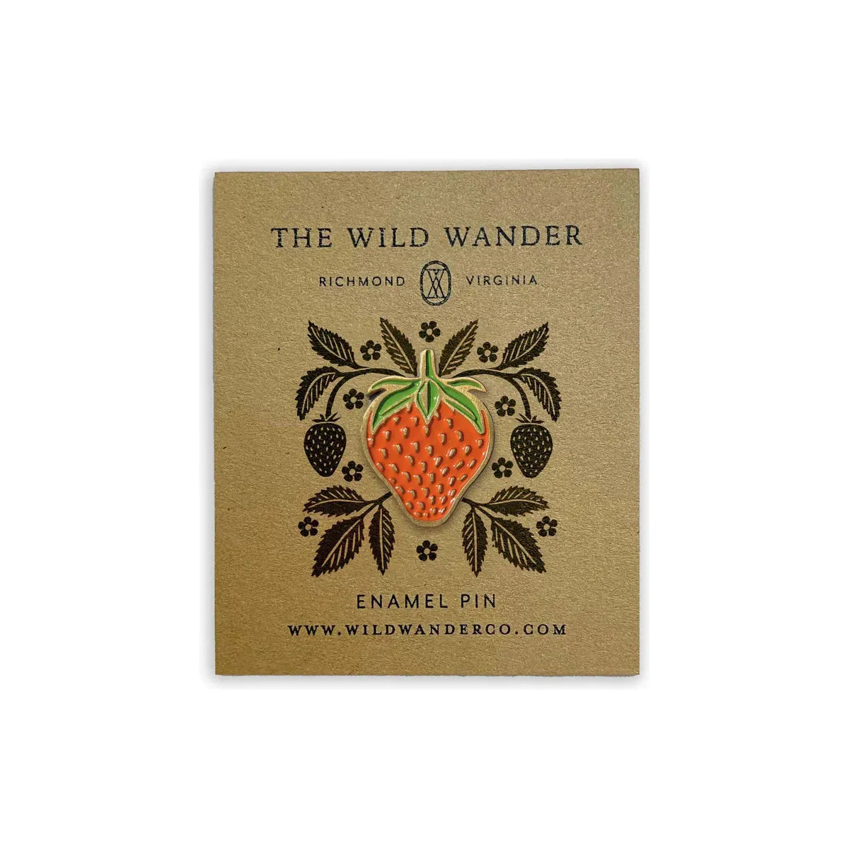 The Wild Wander Strawberry Lapel Pin features a custom illustrated enamel design in the shape of a strawberry with leaves. Branded under "The Wild Wander," it includes location and website information. The pin is packaged plastic-free and comes with a secure rubber backer for durability.