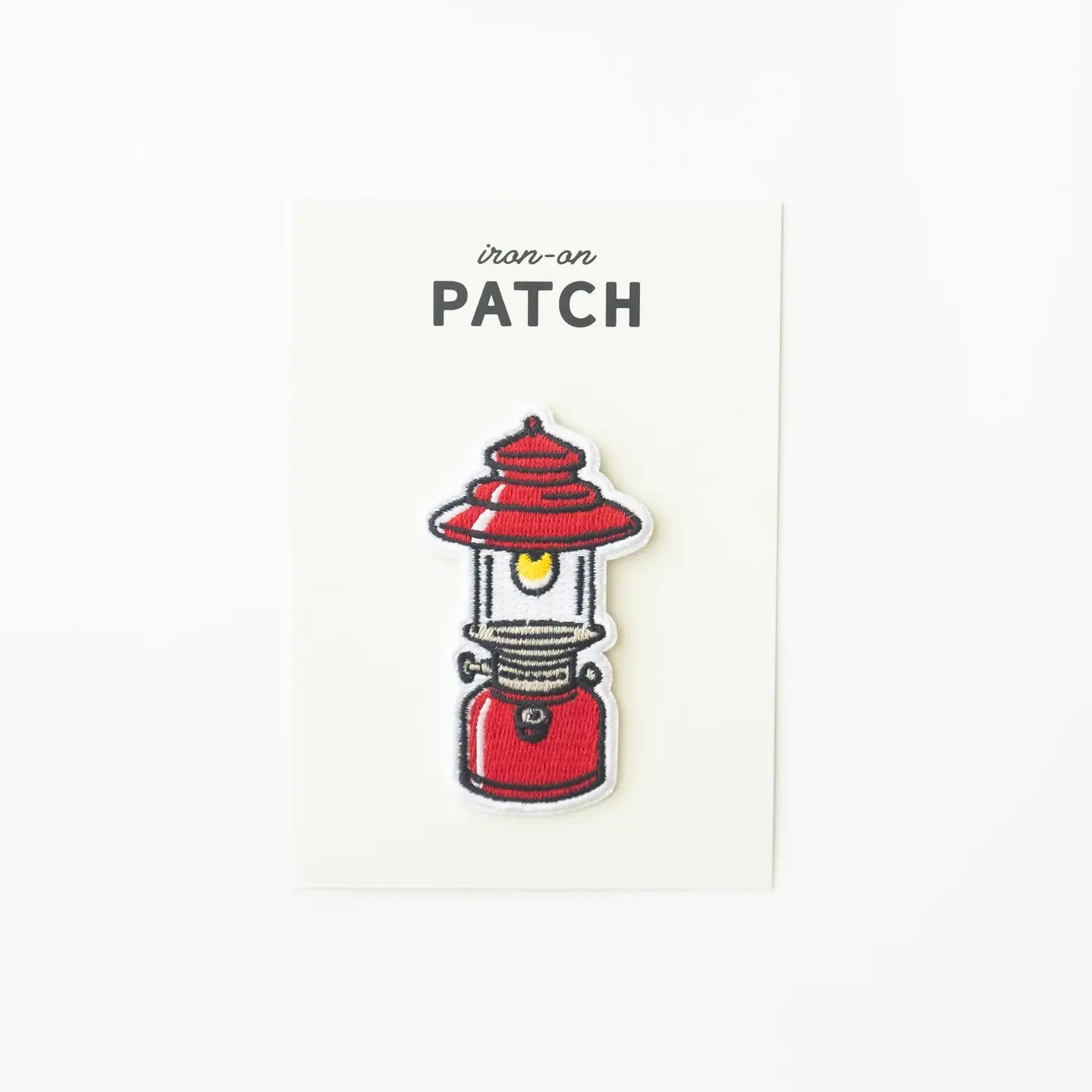 Union made camping lantern patch with yellow flame, embroidered on white card; ideal gift for outdoor enthusiasts and hikers.
