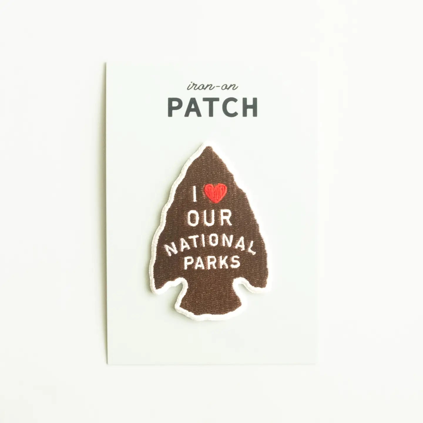 National Parks Arrow Head embroidered patch says “I ♥ Our National Parks” displayed on a white card. Perfect for park lovers.