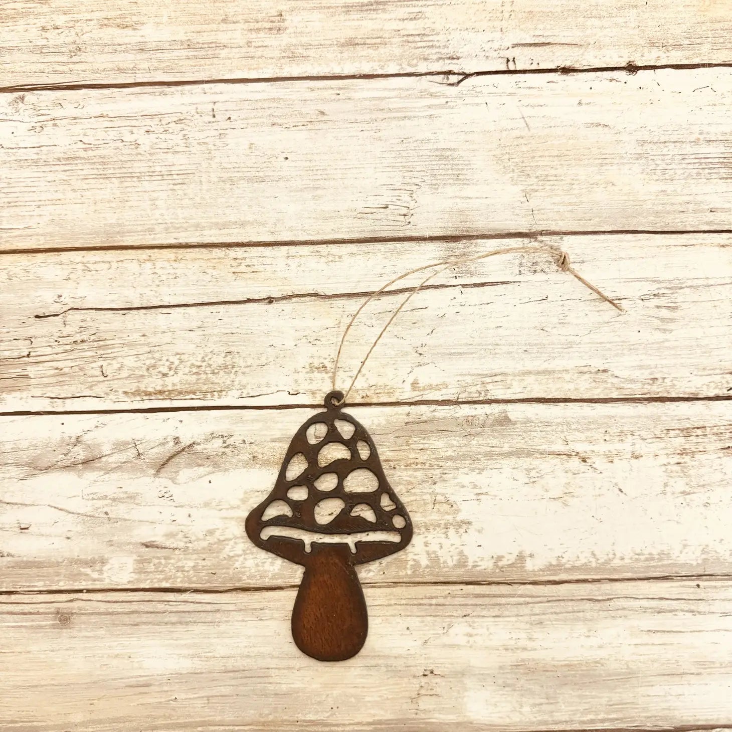Universal Ironworks Straight Mushroom Hanging Decoration displayed on rustic whitewashed wood, perfect home decor accent or gift idea.
