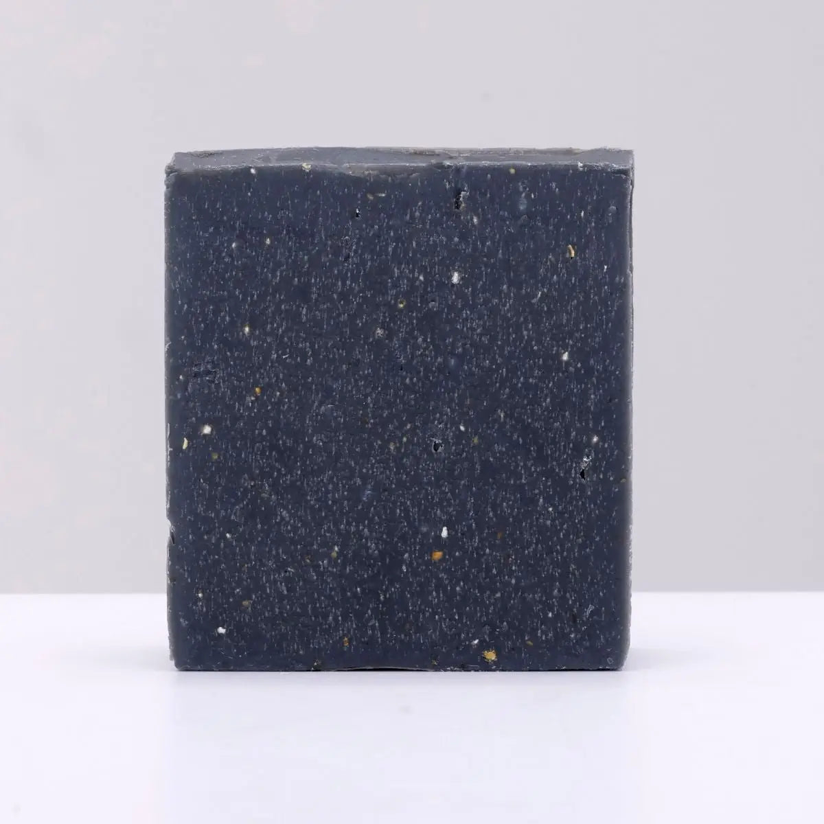 The Black Stuff Soap - Atlantic Pine Tar bar, natural handmade soap, displayed on a plain light gray background.