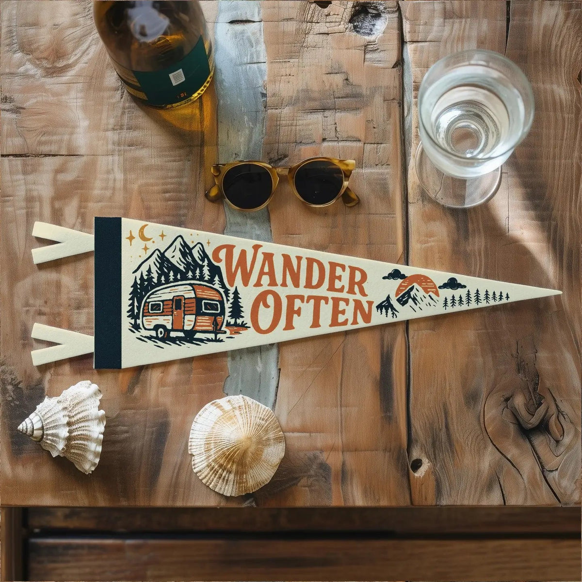 Forager Provisions LTD Benoit Design Co Wander Often felt pennant with camper and mountain graphic on wooden table