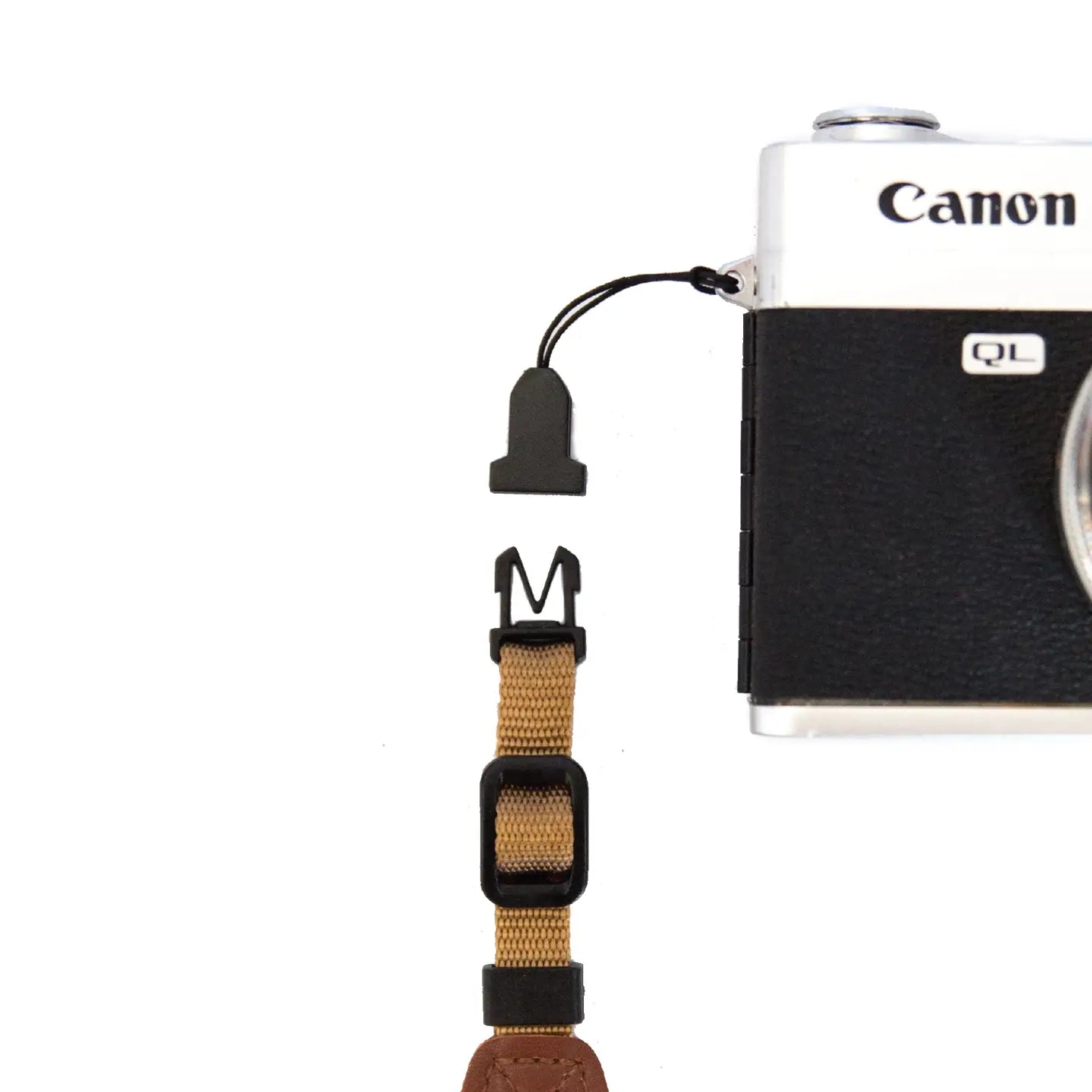 Canon camera close-up with Wildtree Camera Strap Adaptors and quick-release buckles on white background, photography gear.