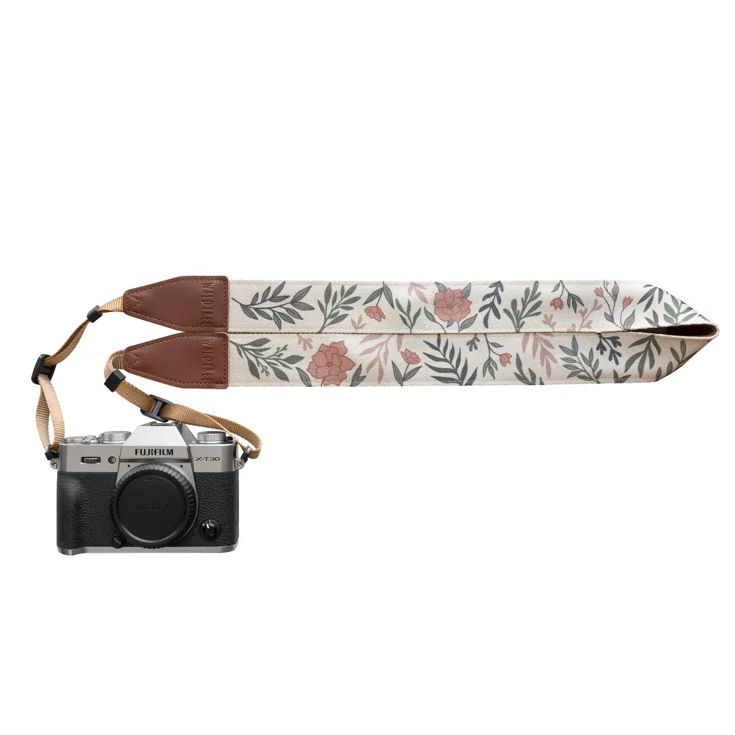 Black Fujifilm camera with Wildtree Moody Flower camera strap, brown leather accents, stylish accessory for photographers.