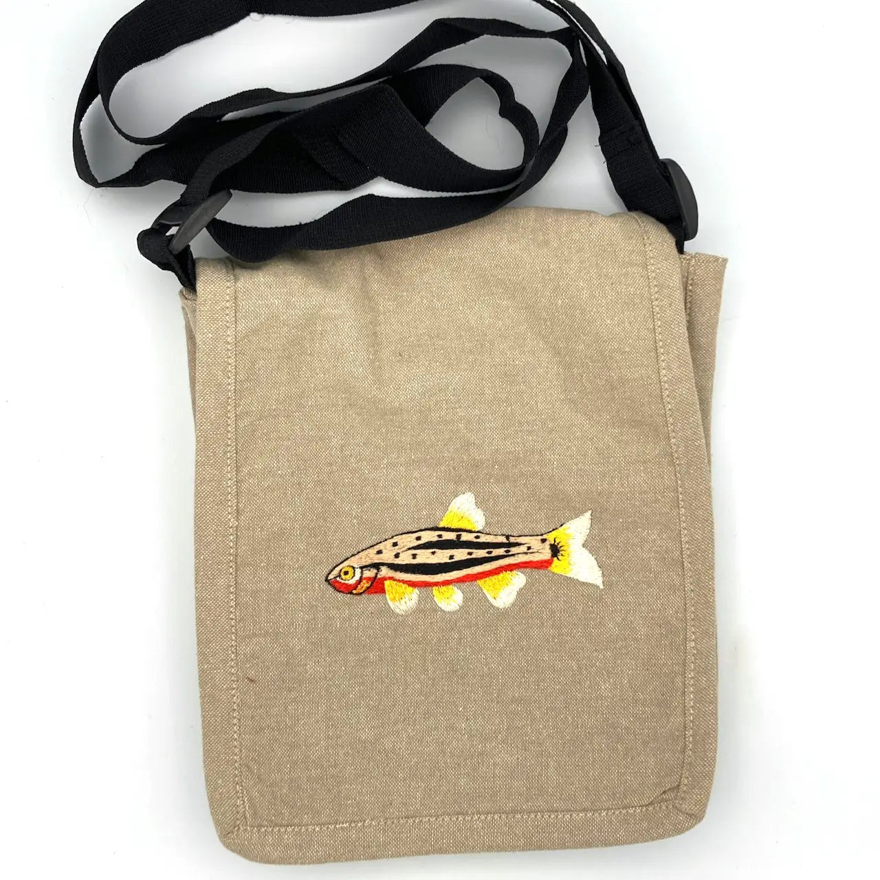 Tan field trip bag with black strap, red belly dace fish embroidery—The Women of the Cloud Forest eco bag for nature lovers.