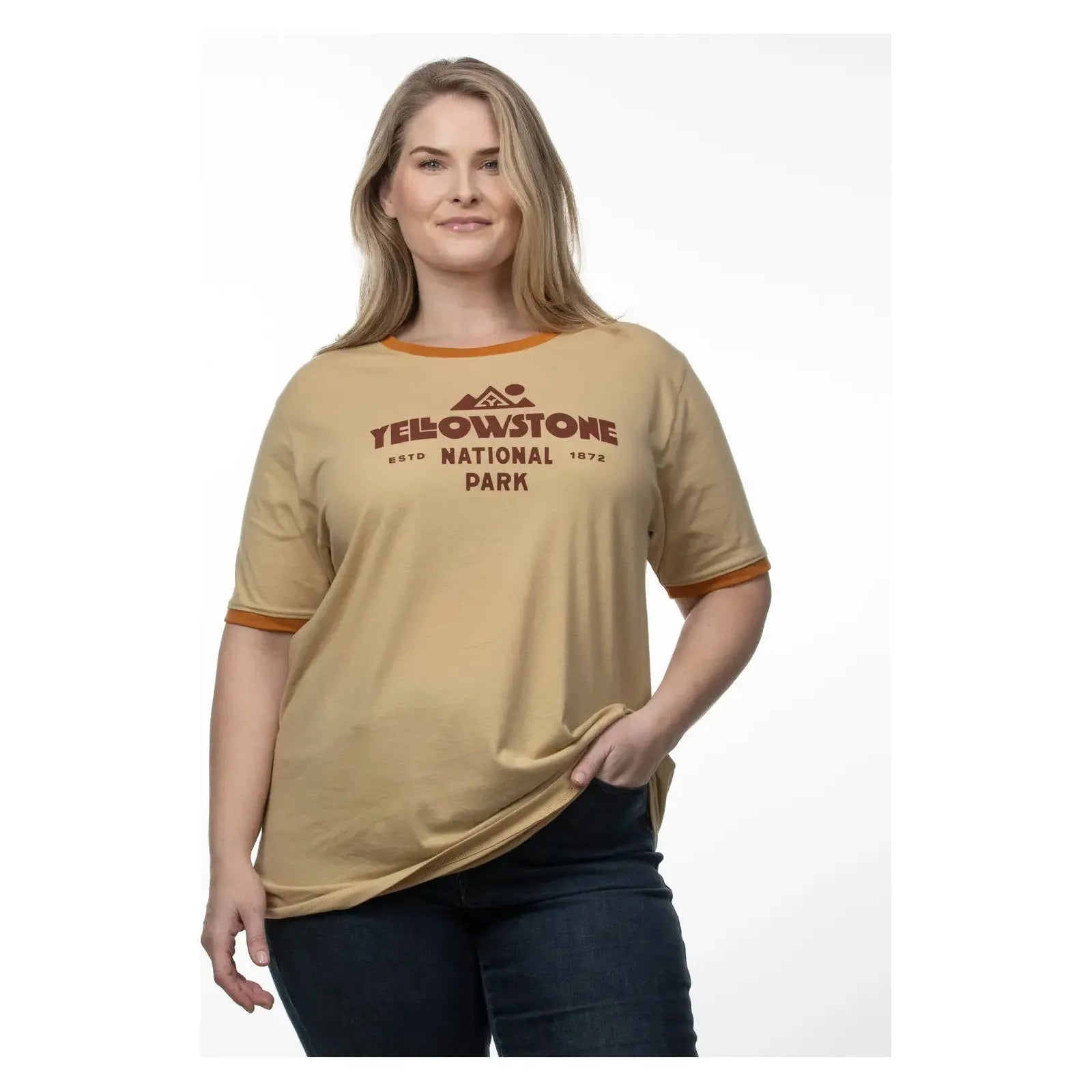 The Landmark Project Yellowstone Type Ringer T-Shirt is a beige tee with orange trim, featuring the text "Yellowstone National Park" and a mountain graphic in brown, sustainably made for eco-conscious adventurers.