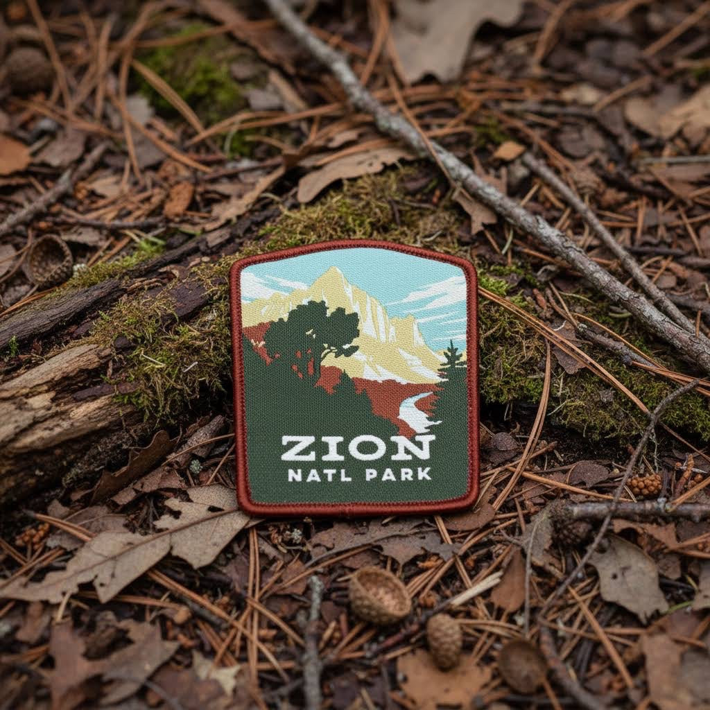 Forager Provisions LTD Zion National Park embroidered patch featuring a mountain landscape on a forest floor background