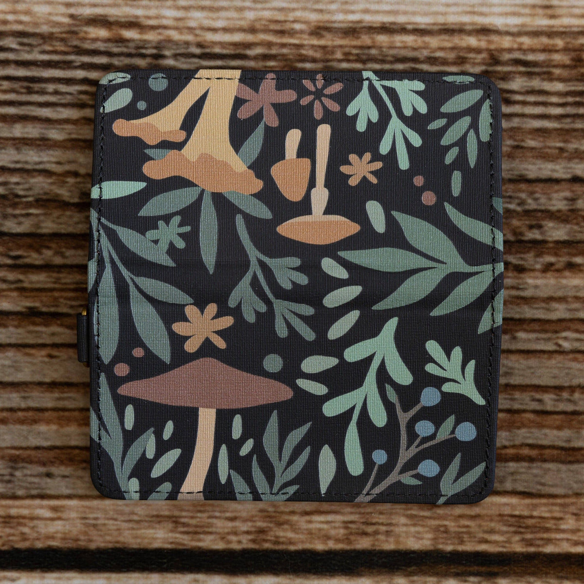 Forager Provisions LTD Wildtree Forest Foliage card holder with mushroom and woodland print on a wooden background.