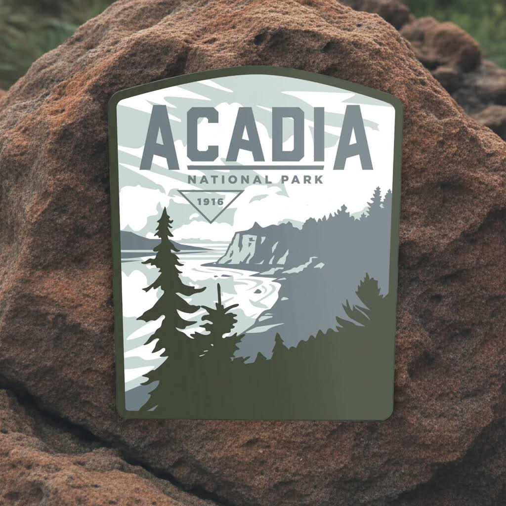 Forager Provisions LTD Acadia National Park vinyl sticker featuring a scenic coastal landscape on a brown rock