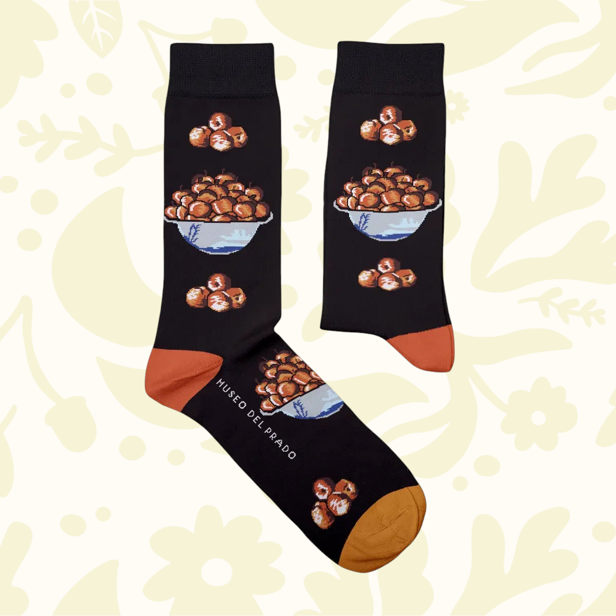 Forager Provisions LTD black cotton socks featuring an Apple Bowl still life print inspired by Tomás Hiepes art.