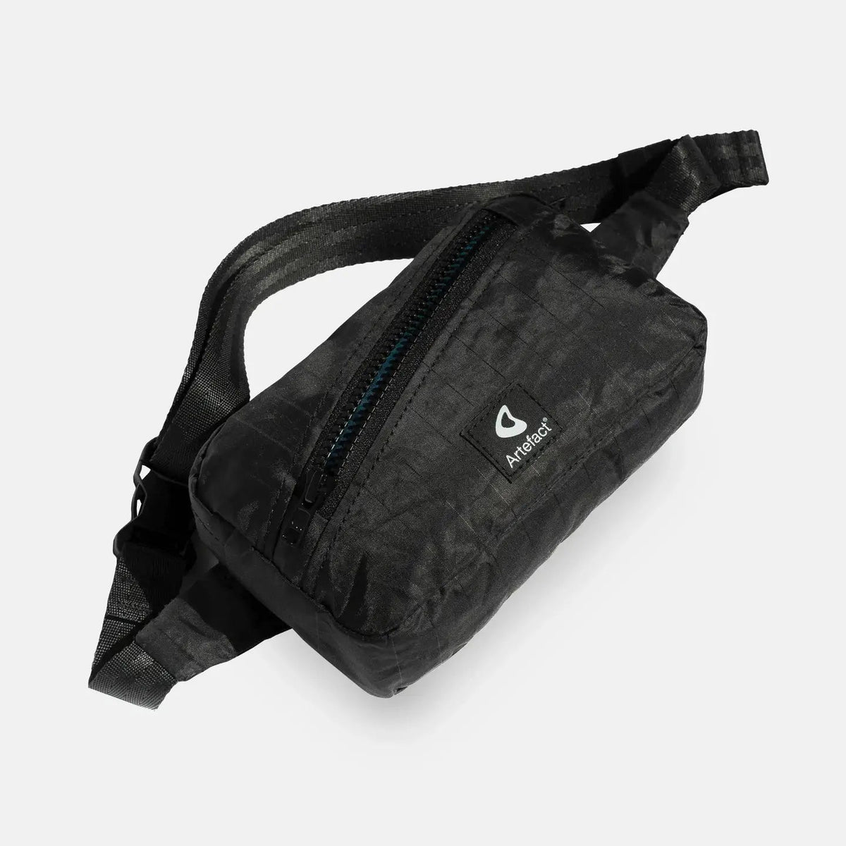 Forager Provisions LTD Artefact Eco black banana sling bag made from upcycled wind sail fabric with adjustable strap.