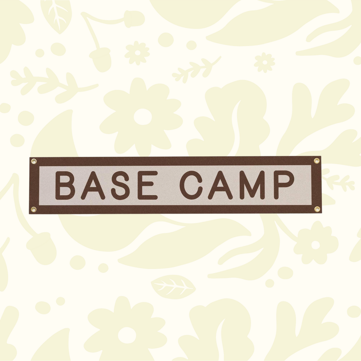 Forager Provisions LTD Benoit's Design Co. Base Camp felt wall banner with brass grommets on a floral background