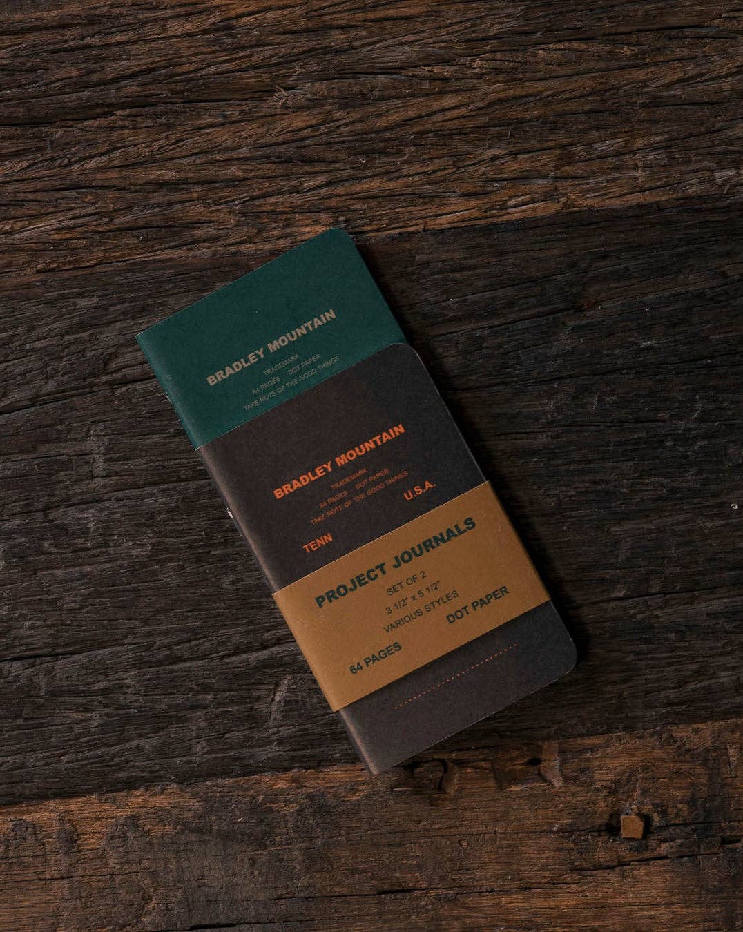 Forager Provisions LTD Bradley Mountain 2-pack pocket journals with vintage green and brown covers on rustic wood.
