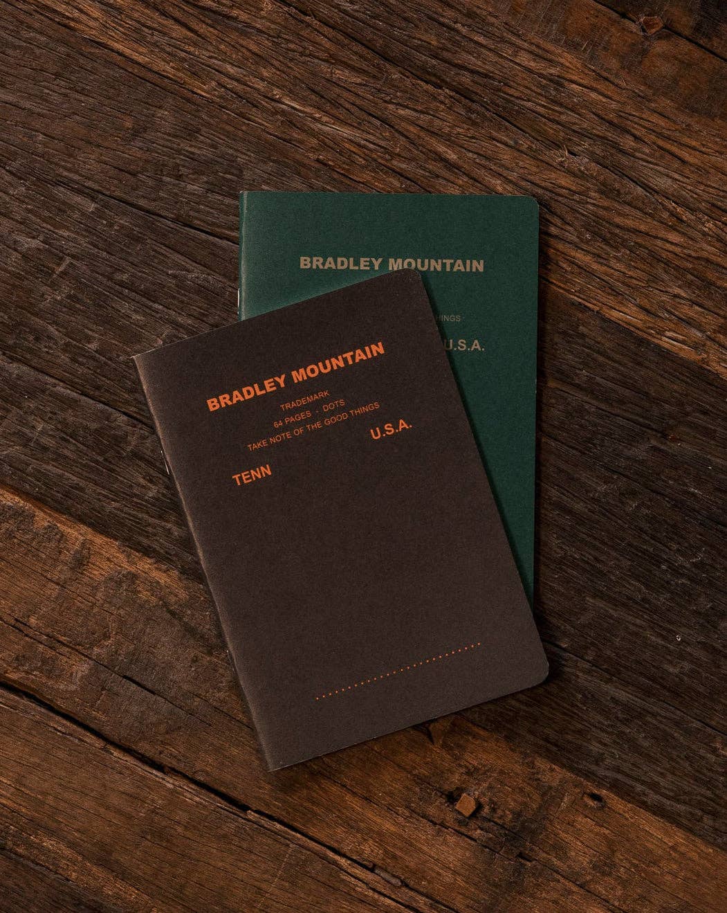 Forager Provisions LTD Bradley Mountain 2-pack of large vintage-style staple-bound journals on a wooden surface