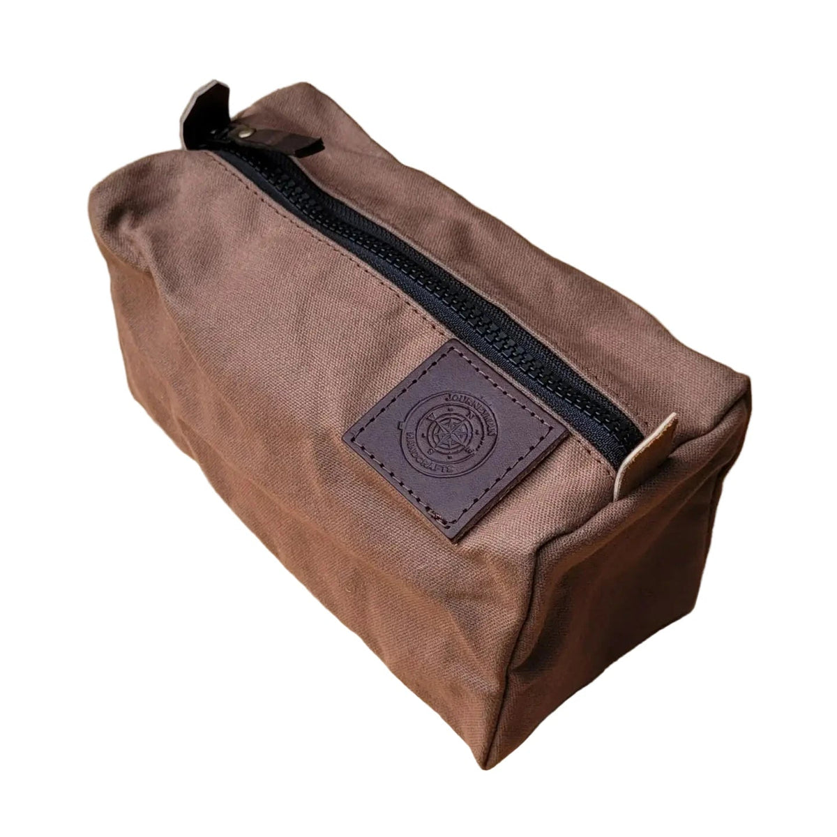 Forager Provisions LTD Journeyman Handcraft brown waxed canvas camping peg case with a rugged black YKK zipper.