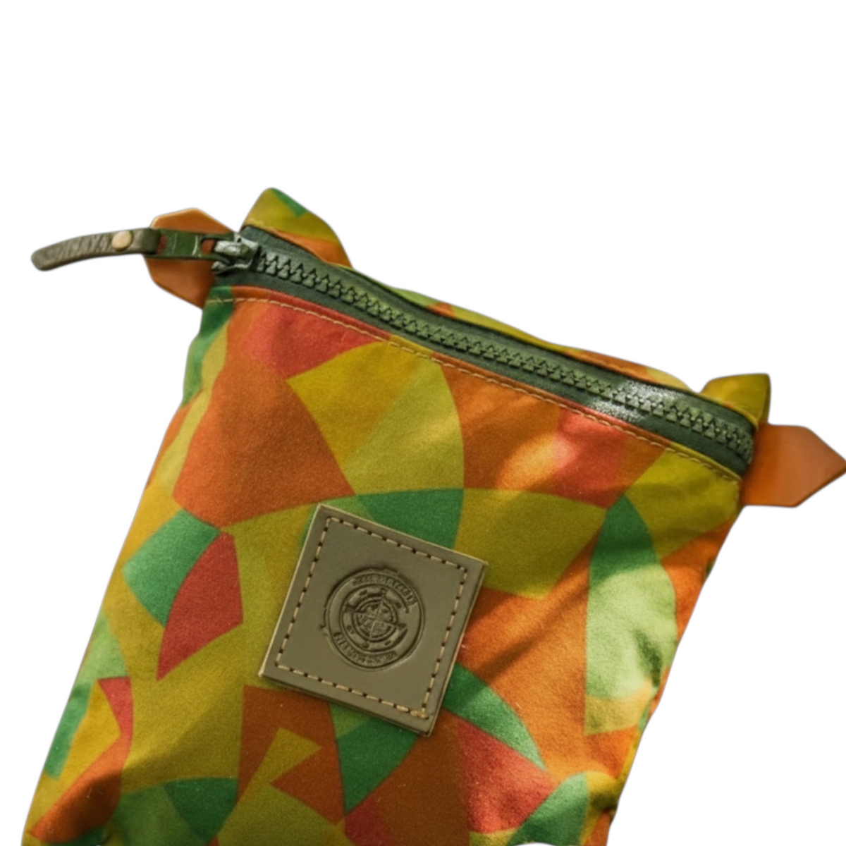 Forager Provisions LTD Journeyman Craft camo zipper pouch in geometric orange, green, and yellow reclaimed fabric.
