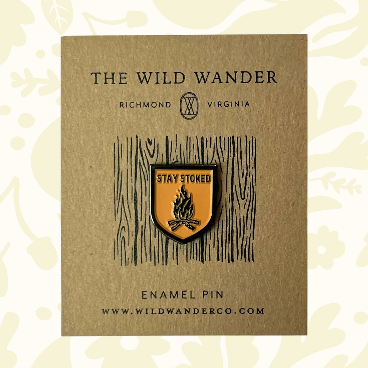 Forager Provisions LTD The Wild Wander Stay Stoked enamel pin featuring a campfire design on a gold-tone shield.