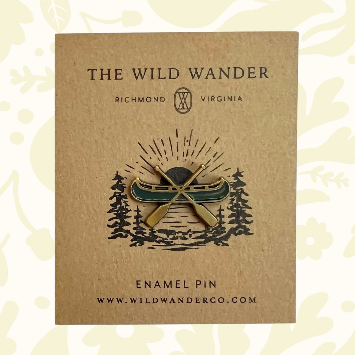 Forager Provisions LTD The Wild Wander canoe enamel pin with green enamel and gold plating on a kraft backing card.