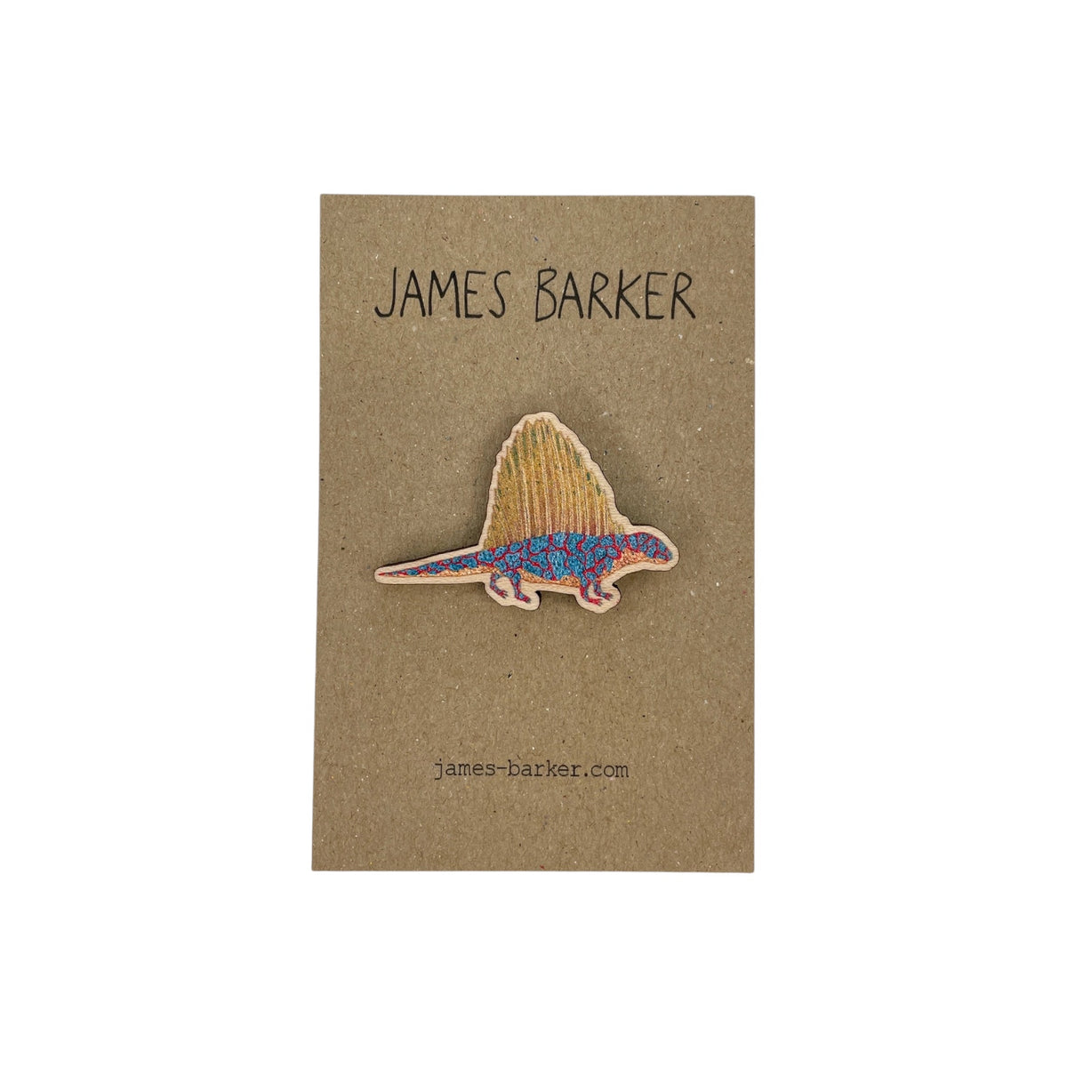 Forager Provisions LTD James Barker Dimetrodon wooden pin on a brown card backing with colourful reptile illustration.