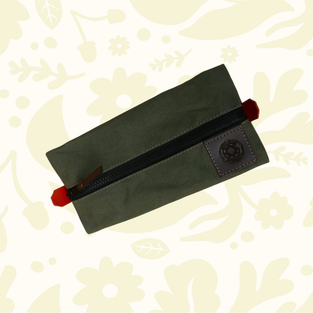 Forager Provisions LTD green canvas pencil case with a durable zip closure and a leather brand patch detail.