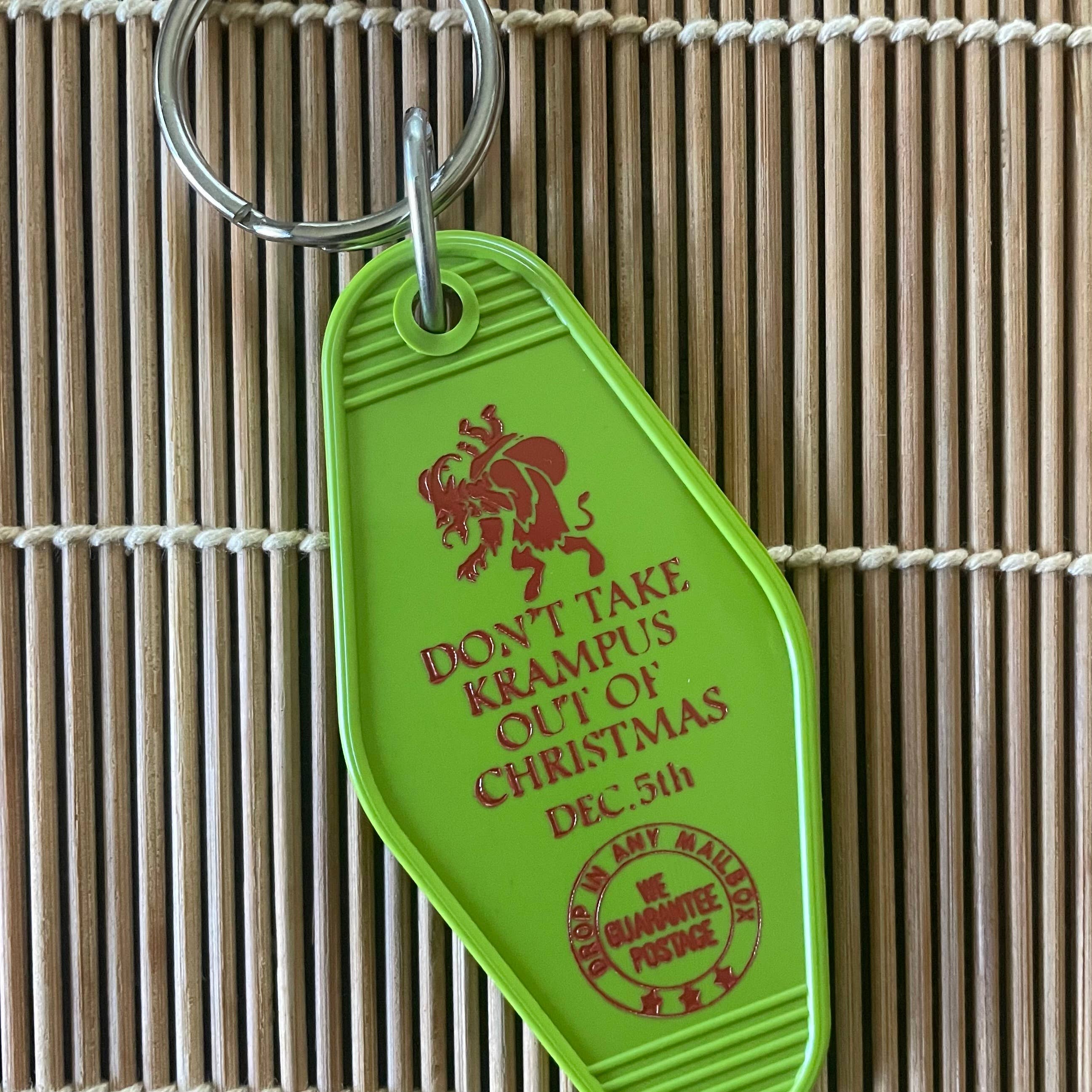 Forager Provisions LTD vintage style green plastic motel key fob with red Krampus graphic and holiday text