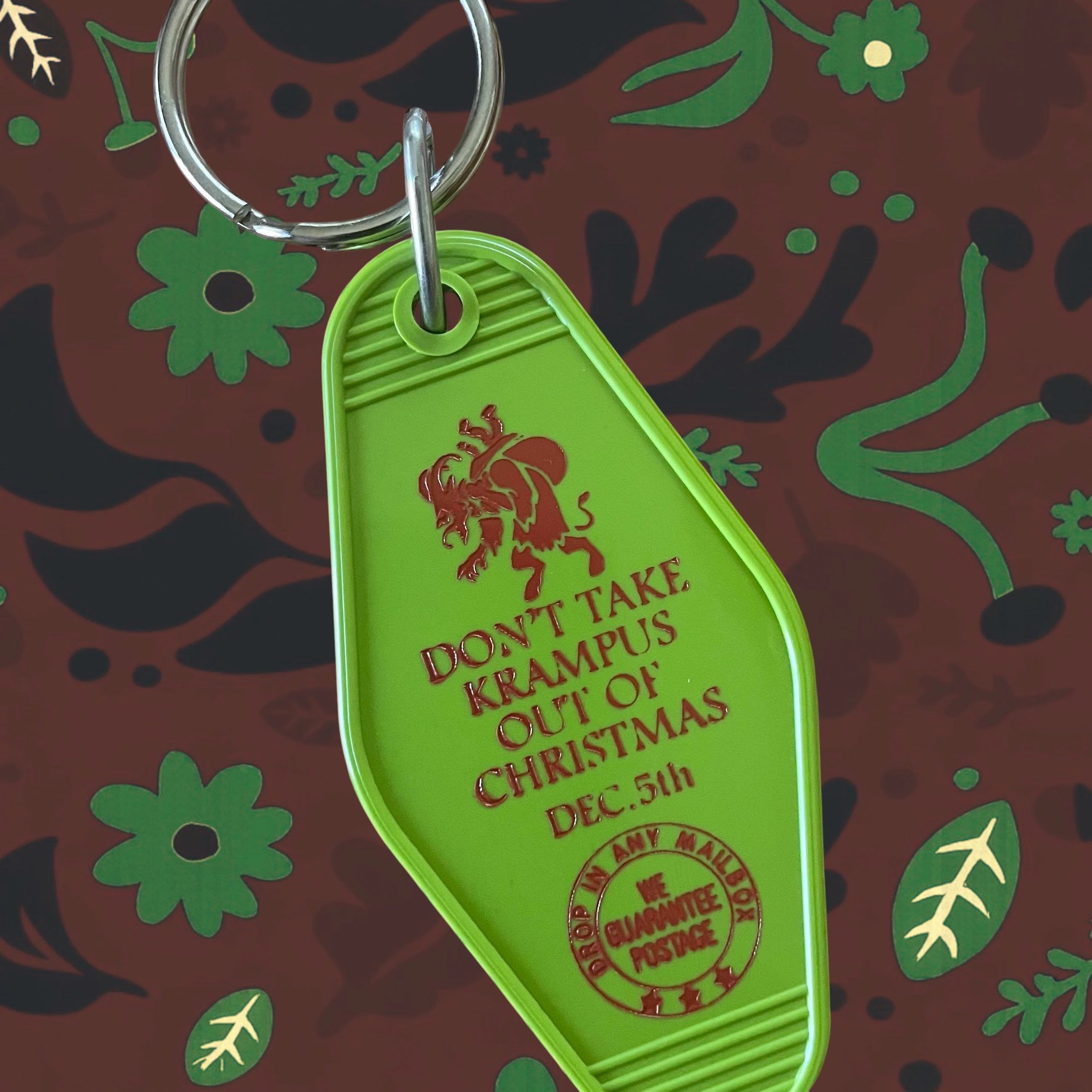 Forager Provisions LTD green vintage-style motel key fob with red Krampus graphic and alt-Christmas text
